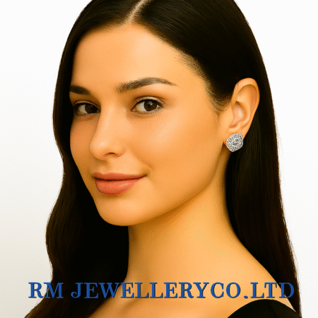 "Close-up of a woman wearing small, round stud earrings with a central pearl or white stone surrounded by clear accent stones in a flower or starburst design. The text 'RM JEWELLERY CO., LTD' is at the bottom."