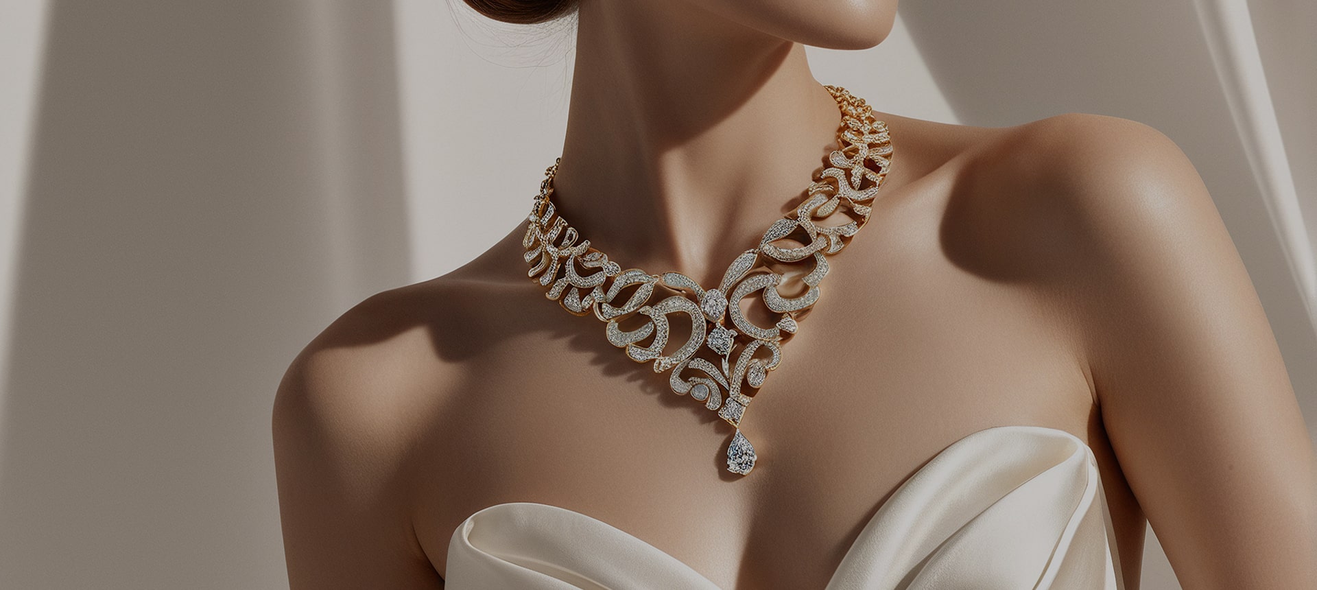 Close-up of a woman wearing a stunning yellow gold bib necklace with intricate scrollwork, paved with diamonds and featuring a large central teardrop diamond pendant.